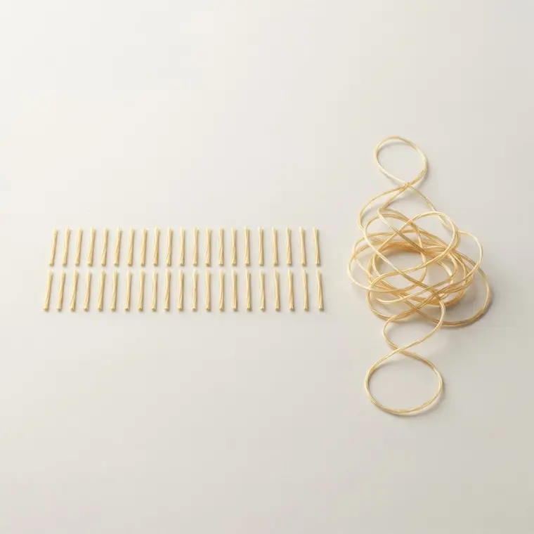 Collagen already cut to usable lengths, next to one long raw strand